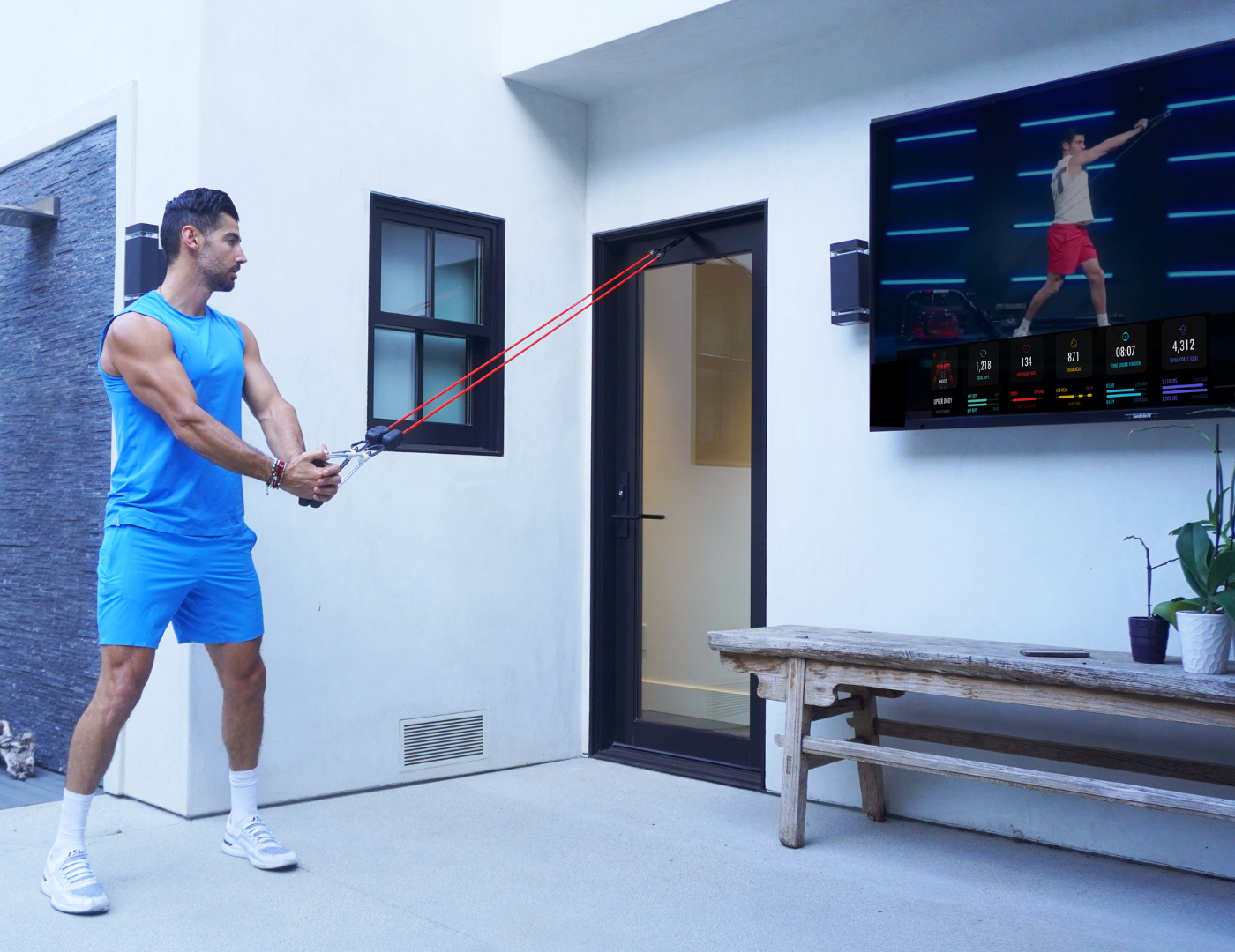 Justin Norris doing workout with LIT Axis smart resistance bands