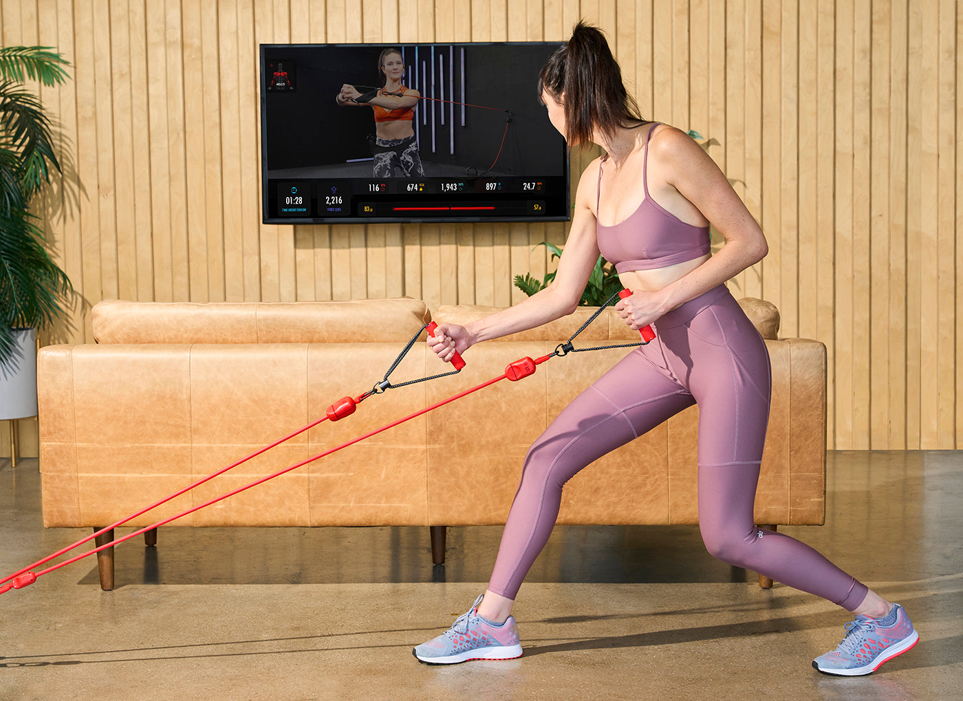 A woman doing workout with LIT Axis