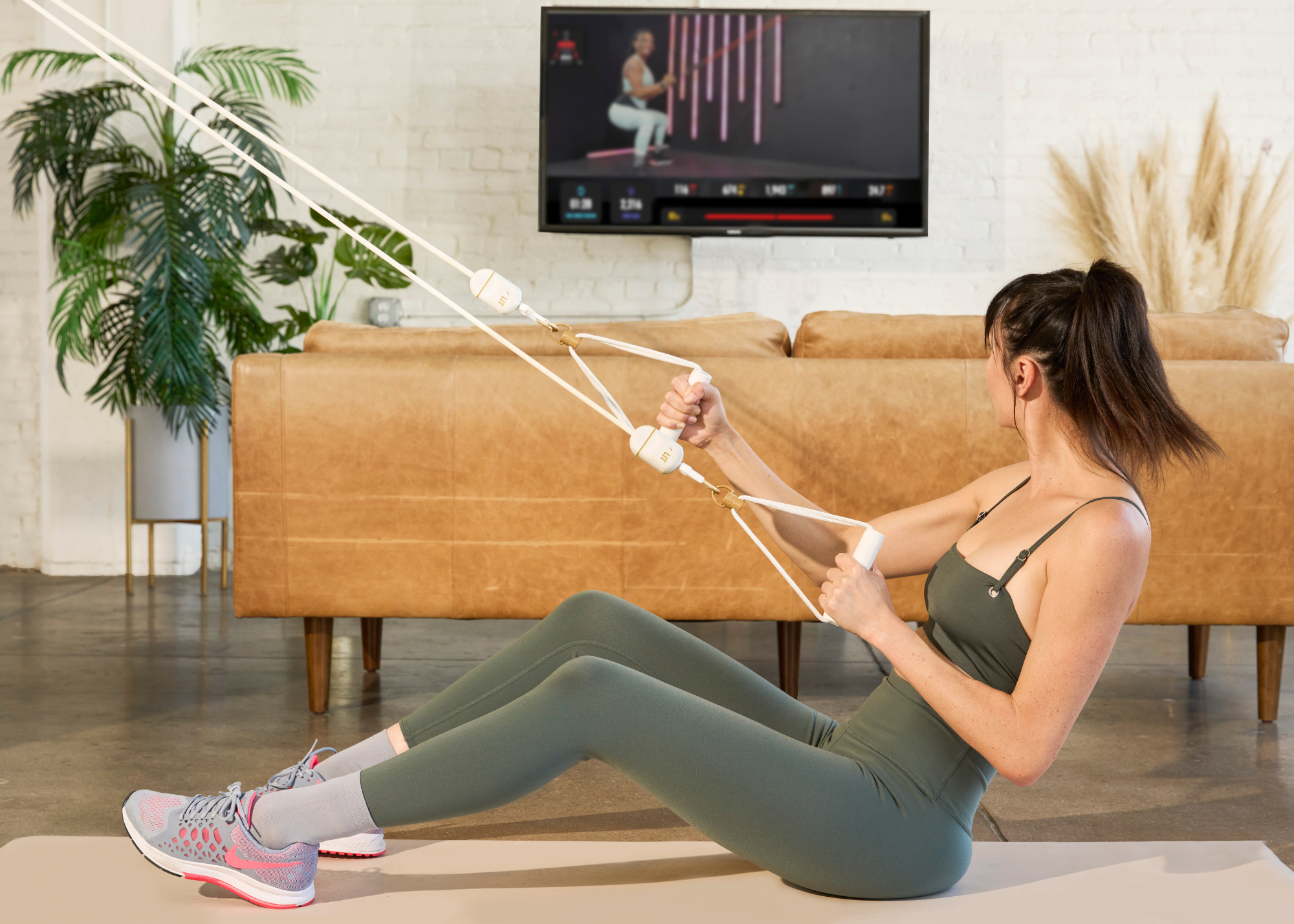 A Woman doing exercise with LIT Axis resistance band