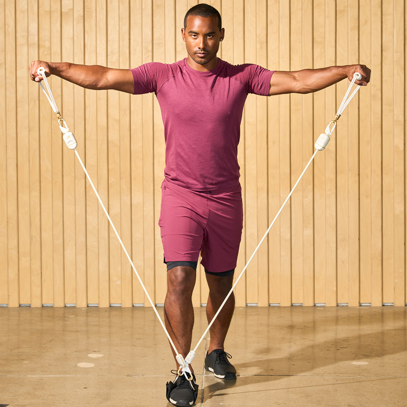 A man doing workout with LIT Axis resistance bands