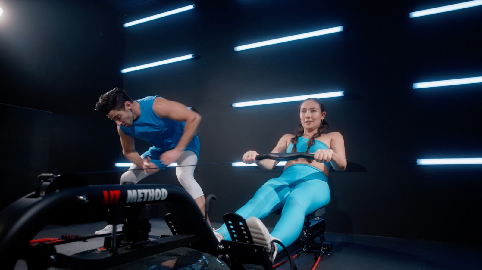 Male and Female working out together on the LIT machine