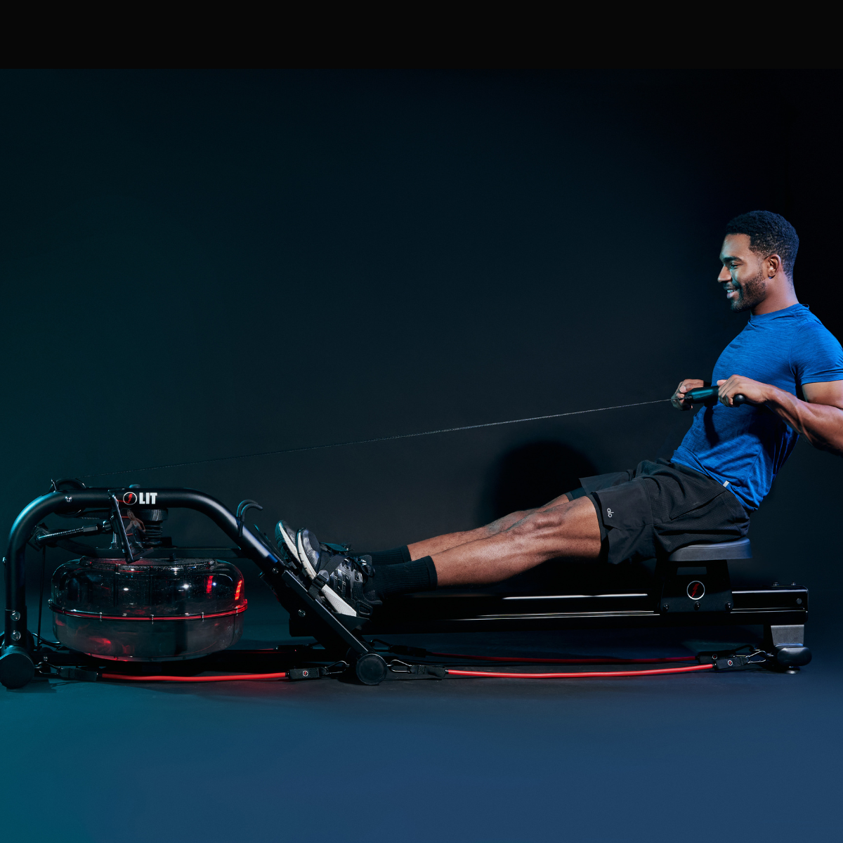 A man doing rowing workout on the LIT Strength Machine