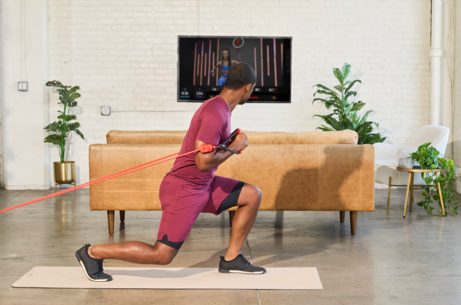 A man doing exercise with LIT Axis smart resistance band