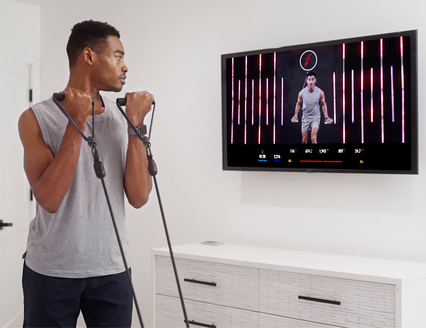 A man using LIT Axis smart resistance bands for strength training