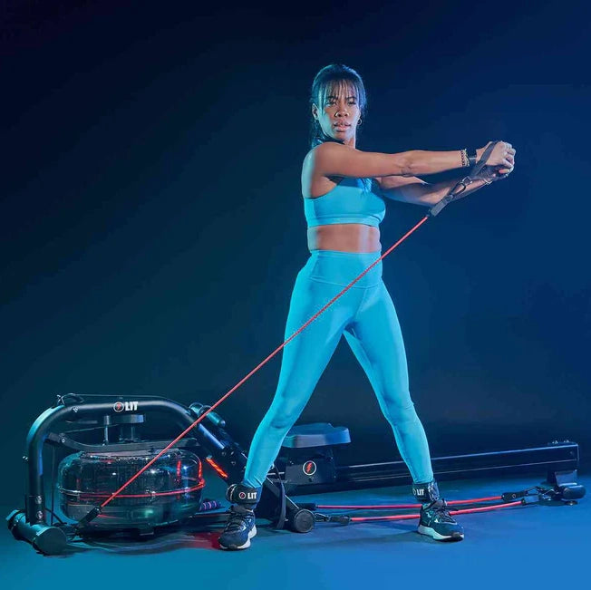 Woman in blue workout outfit, using the LIT bands to exercise